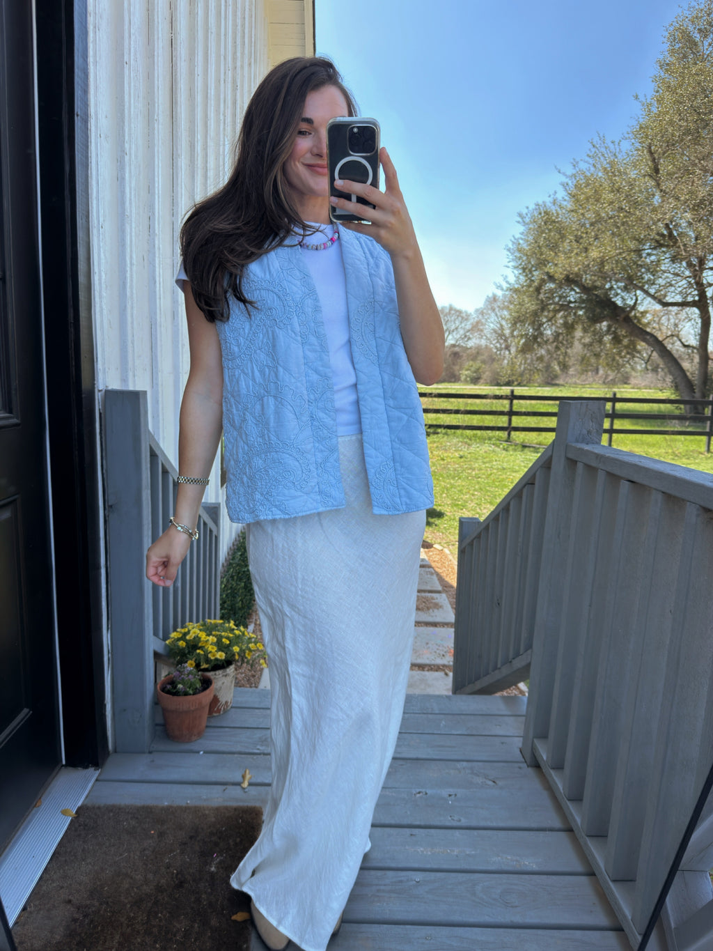Feminine baby blue cotton quilted vest from a women’s boutique styled for everyday wear