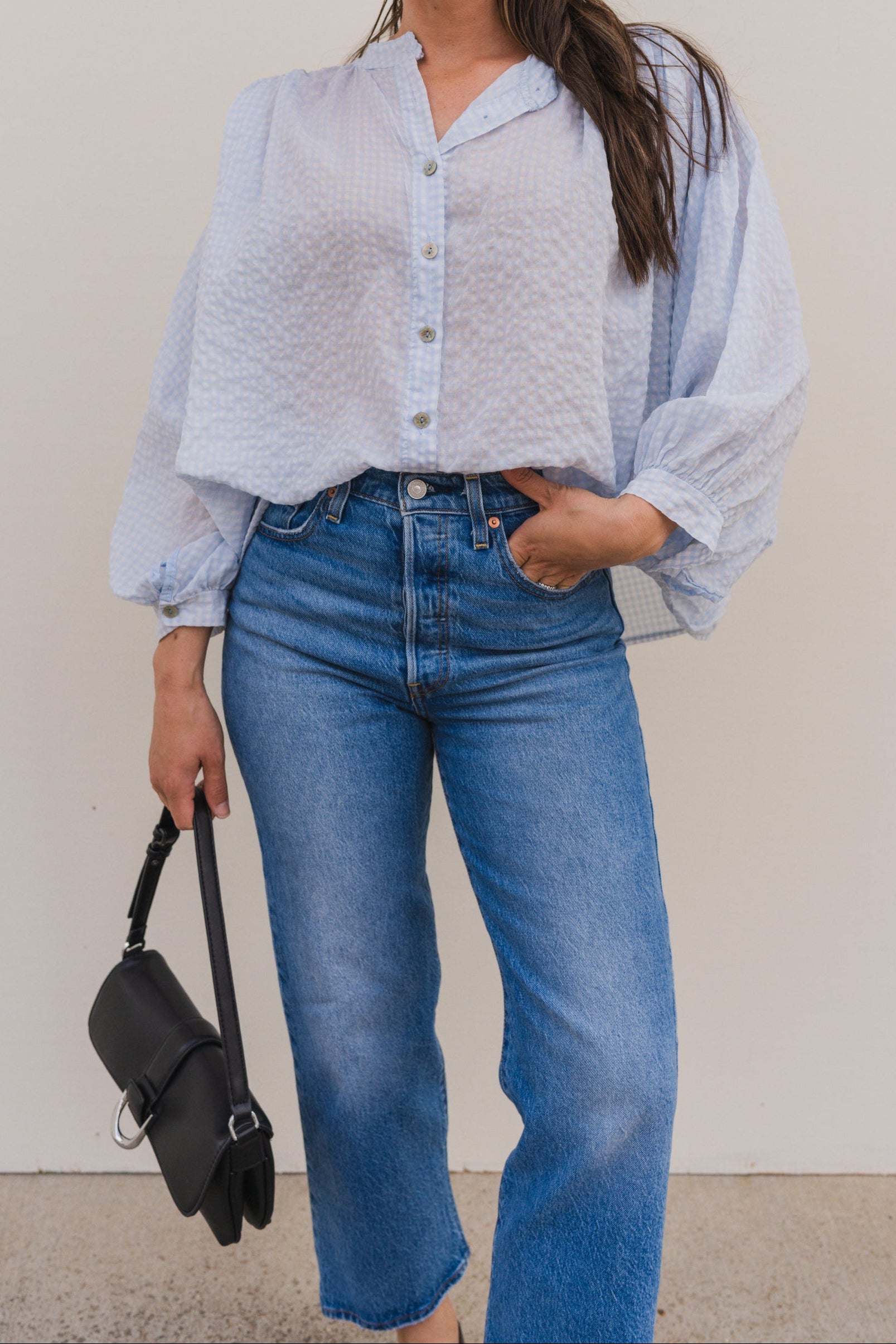 Lightweight blue cotton gingham blouse for women with button front and relaxed fit