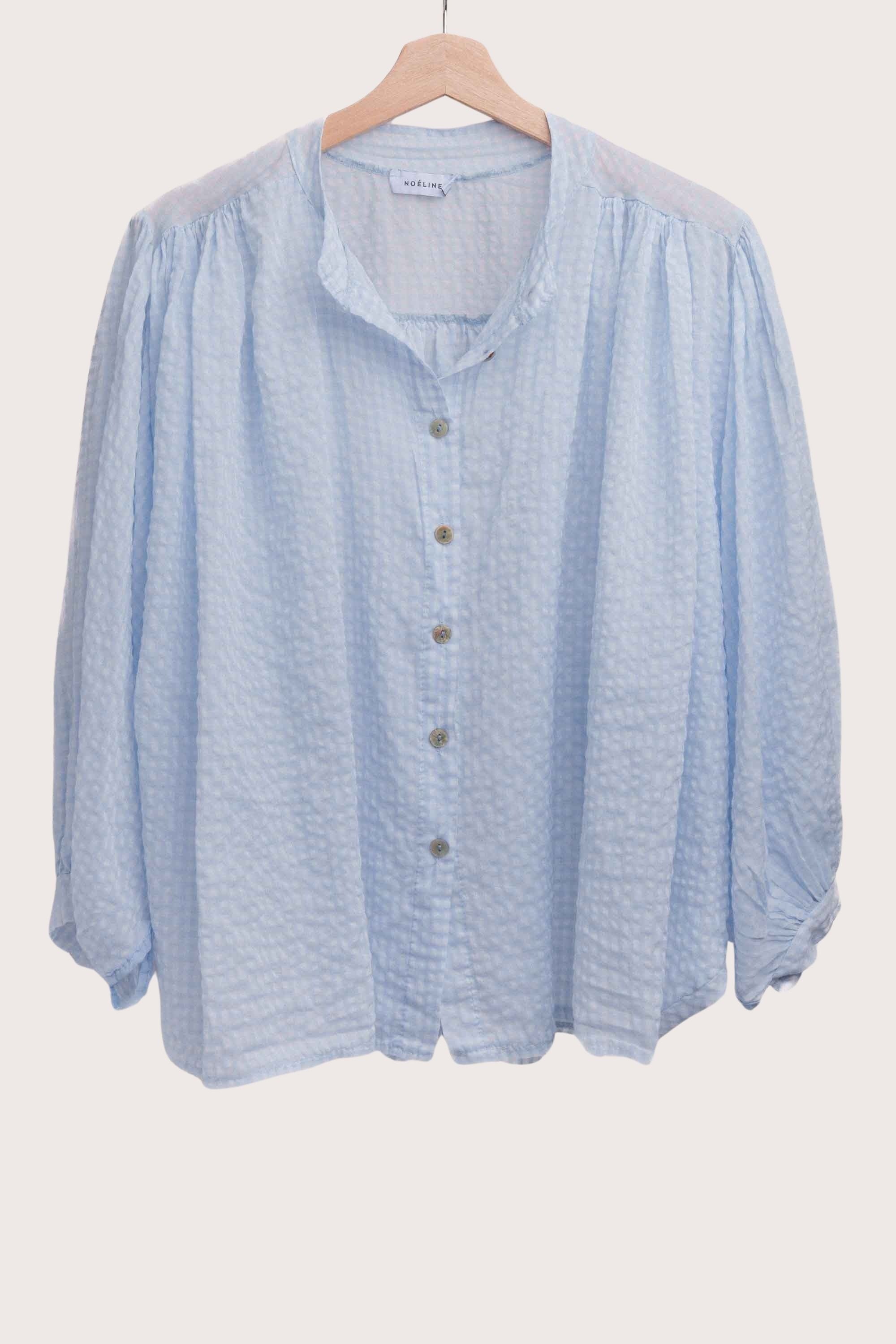 Lightweight blue cotton gingham blouse for women with button front and relaxed fit