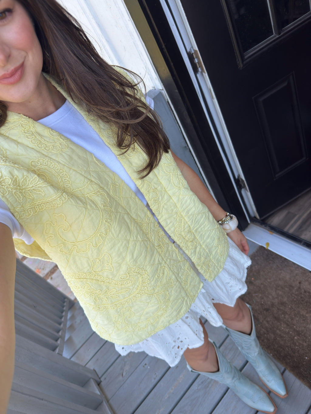 Women’s lightweight butter yellow cotton quilted vest styled with a casual everyday outfit and cowboy boots
